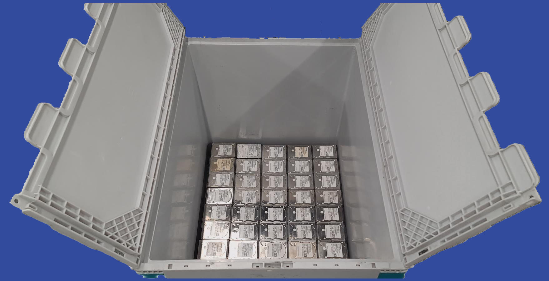 Open crate of storage devices packed for secure destruction